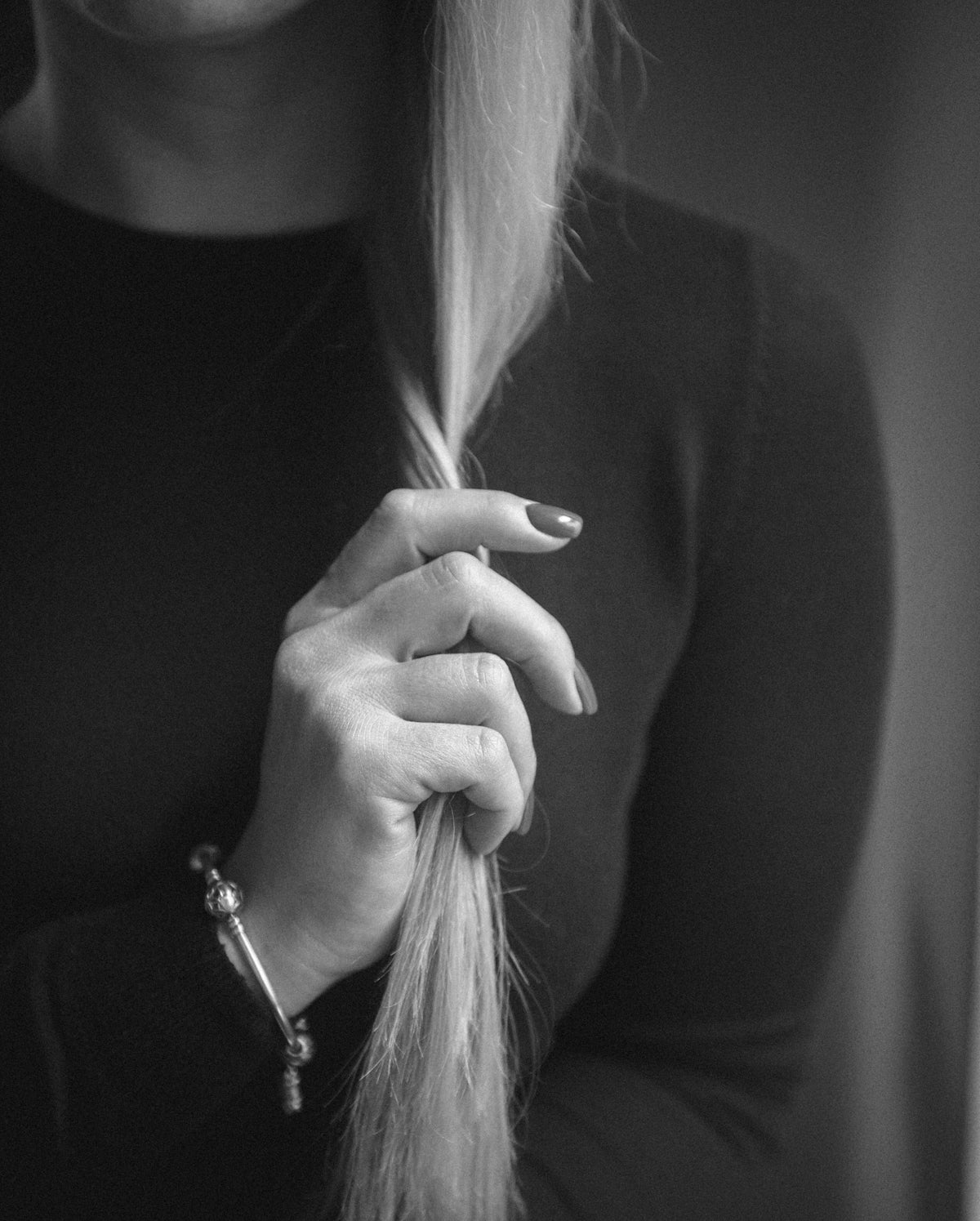 a woman holding her hair